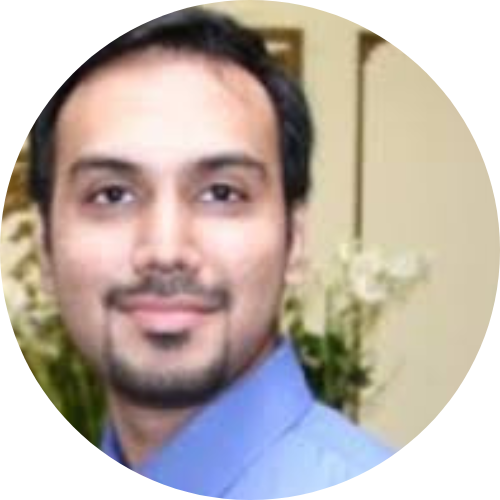 furqan irfan headshot. He has short black hair and beard. He is wearing a blue shirt