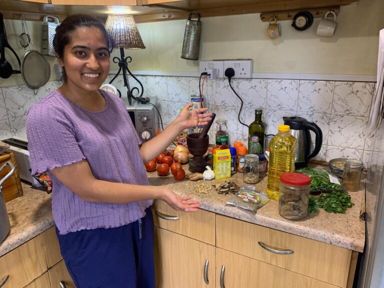 A person standing in front of food ingredients in a kitchen