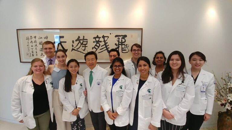 Group of medical students in lab coats
